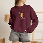 Model wearing maroon Purrtector embroidered cat sweatshirt, holding iced coffee