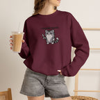 Model wearing maroon I Require Snacks embroidered cat sweatshirt, holding iced coffee