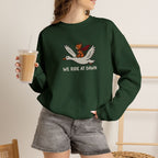 Model wearing forest green We Ride At Dawn embroidered cat sweatshirt, holding iced coffee