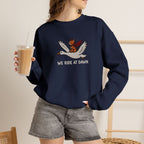 Model wearing navy We Ride At Dawn embroidered cat sweatshirt, holding iced coffee