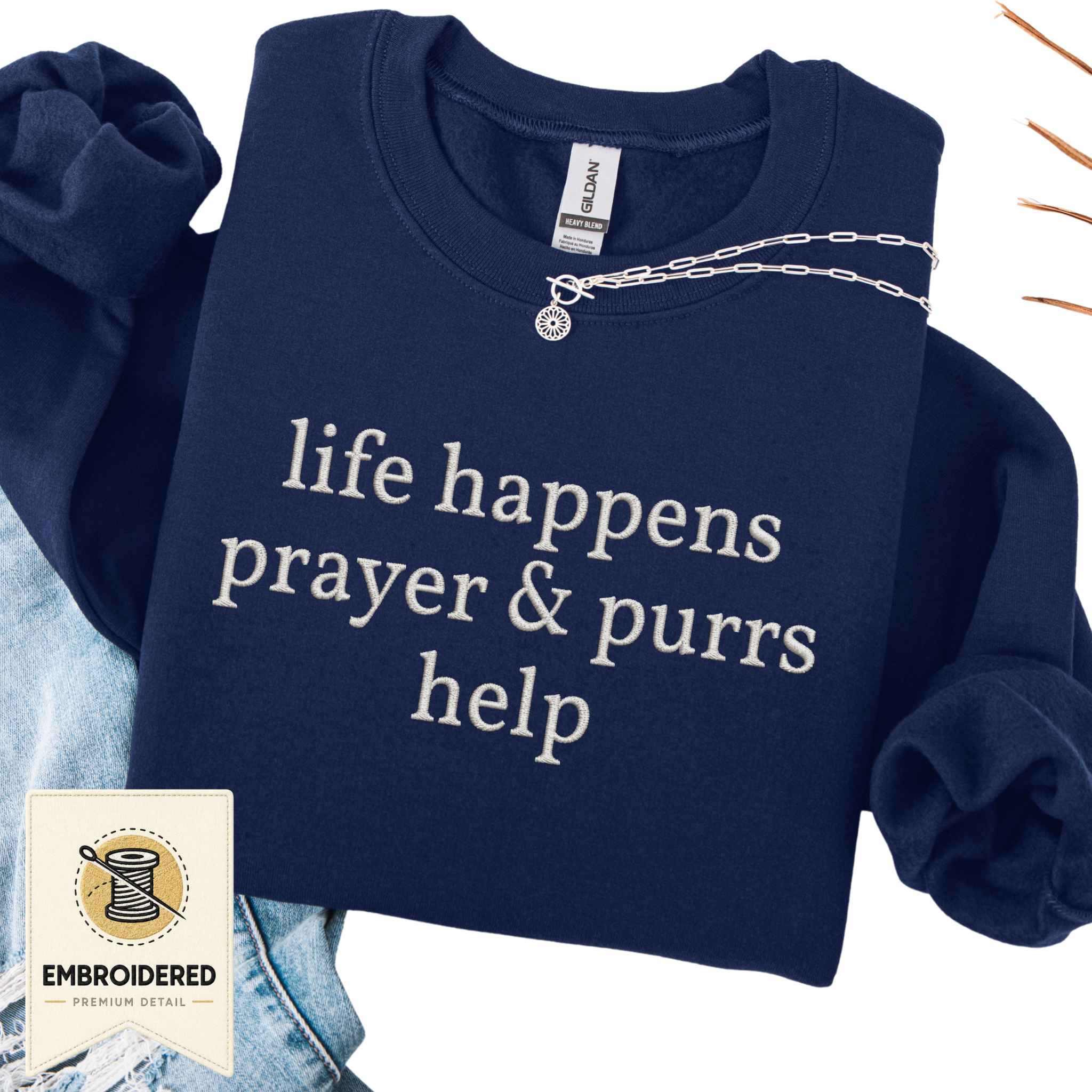 Forest green embroidered cat sweatshirt with a Prayer and Purrs Help design, shown flat