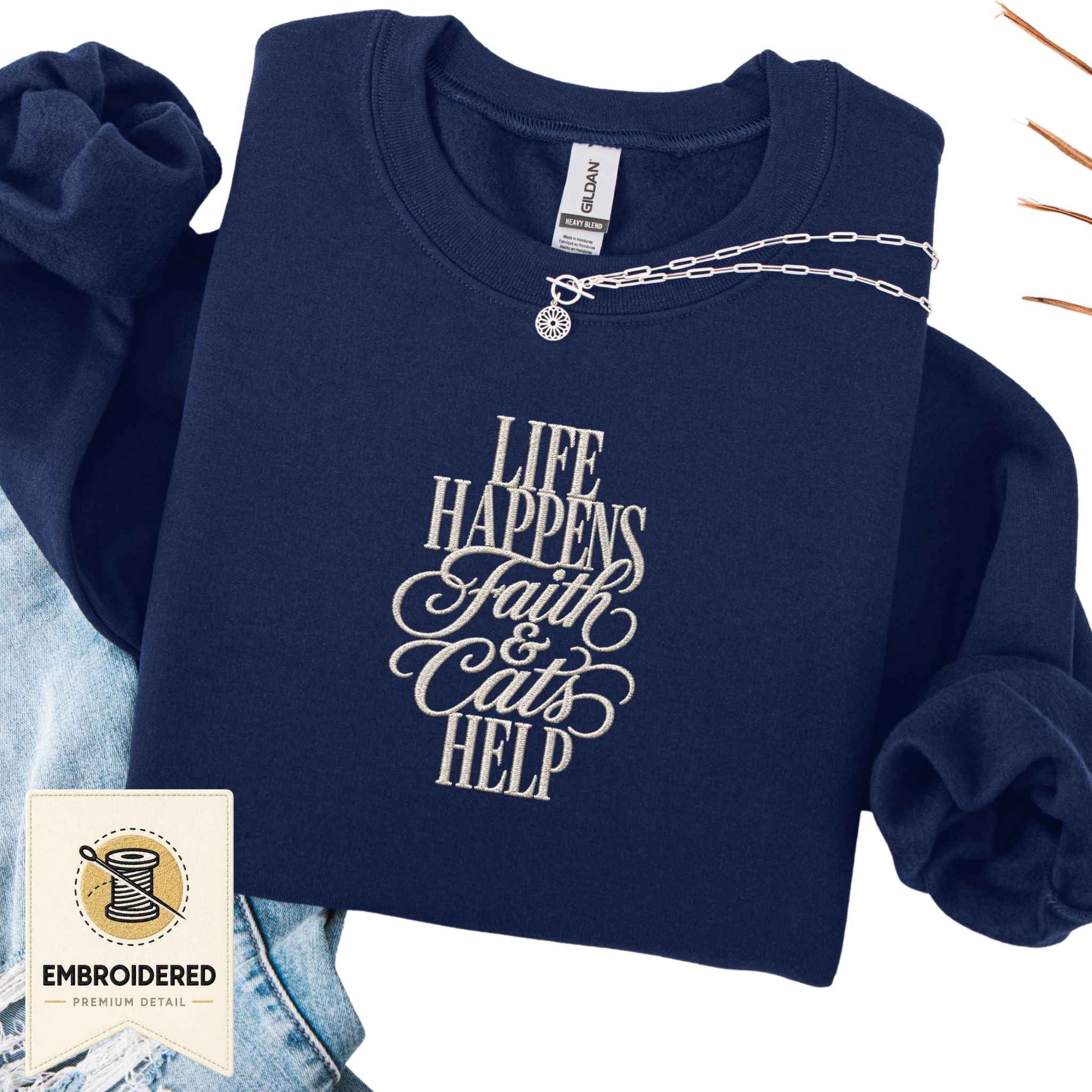 Navy embroidered cat sweatshirt with a small Life Happens Faith and Cats Help chest design, shown flat