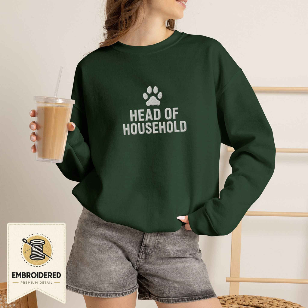 Woman wearing a forest green embroidered Head of Household cat sweatshirt