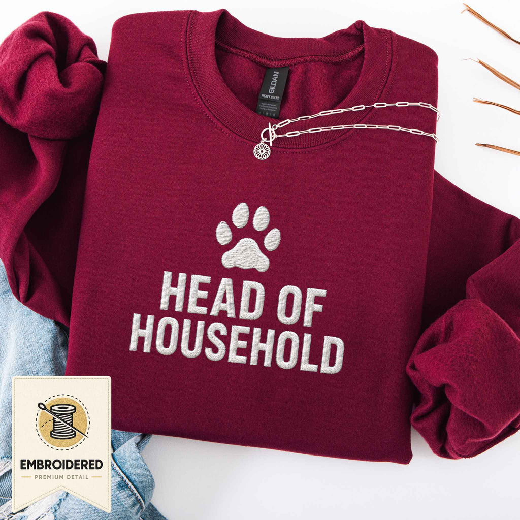 Maroon embroidered cat sweatshirt with a paw and Head of Household chest design, shown flat