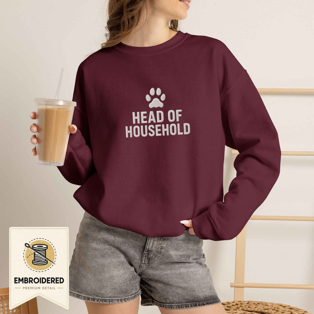 Woman wearing a maroon embroidered Head of Household cat sweatshirt