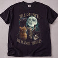 Black cat t-shirt with The Council Demands Treats printed graphic, funny cat lover tee on soft Comfort Colors cotton, flat lay front view