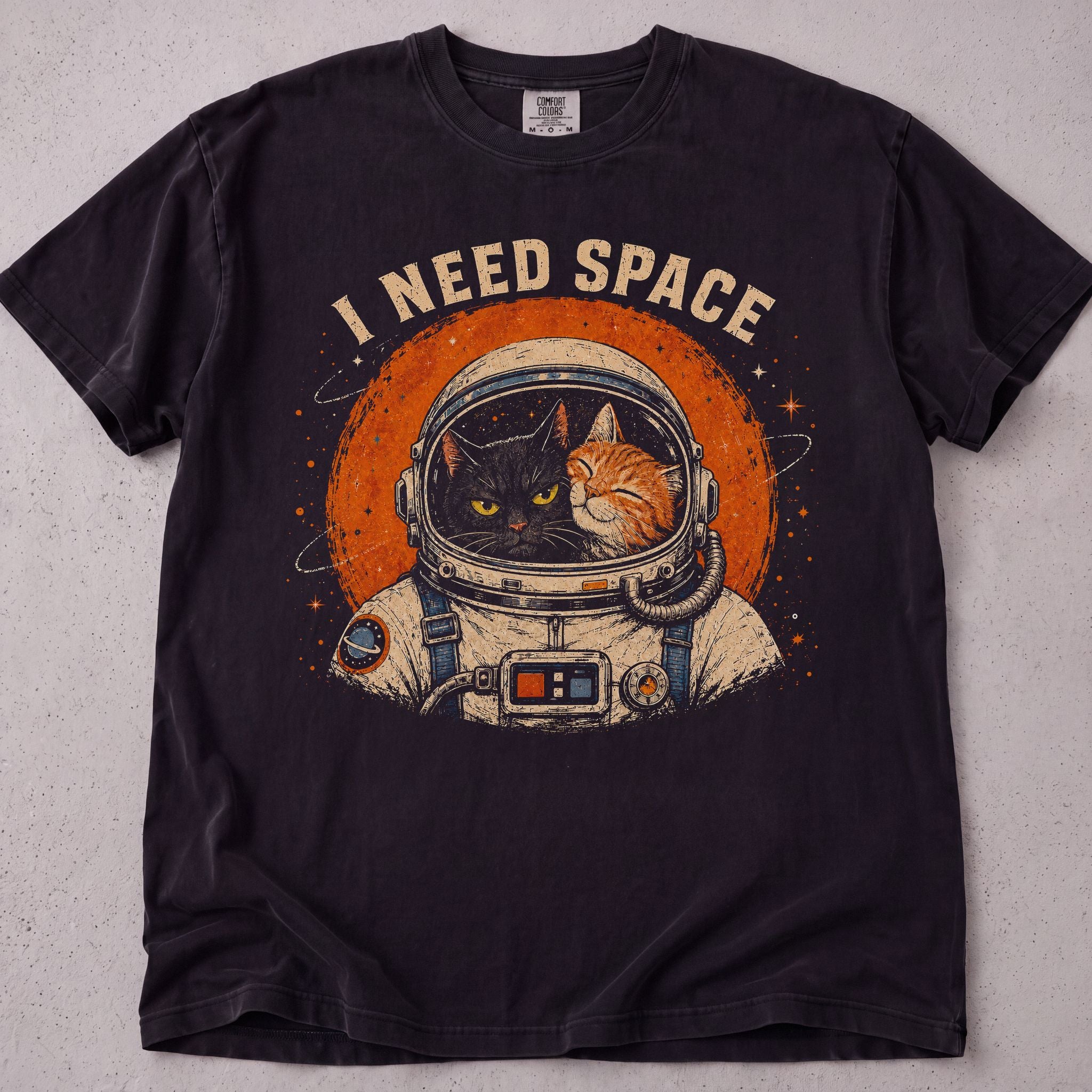 Black cat t-shirt with I Need Space printed graphic, funny cat lover tee on soft Comfort Colors cotton, flat lay front view