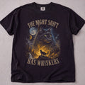Black cat t-shirt with The Night Shift Has Whiskers printed graphic, funny cat lover tee on soft Comfort Colors cotton, flat lay front view