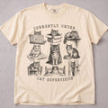 Ivory cat t-shirt with Currently Under Cat Supervision printed graphic, funny cat lover tee on soft Comfort Colors cotton, flat lay front view