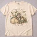 Ivory cat t-shirt with Rough Day Soft Cat printed graphic, cat lover tee on soft Comfort Colors cotton, flat lay front view