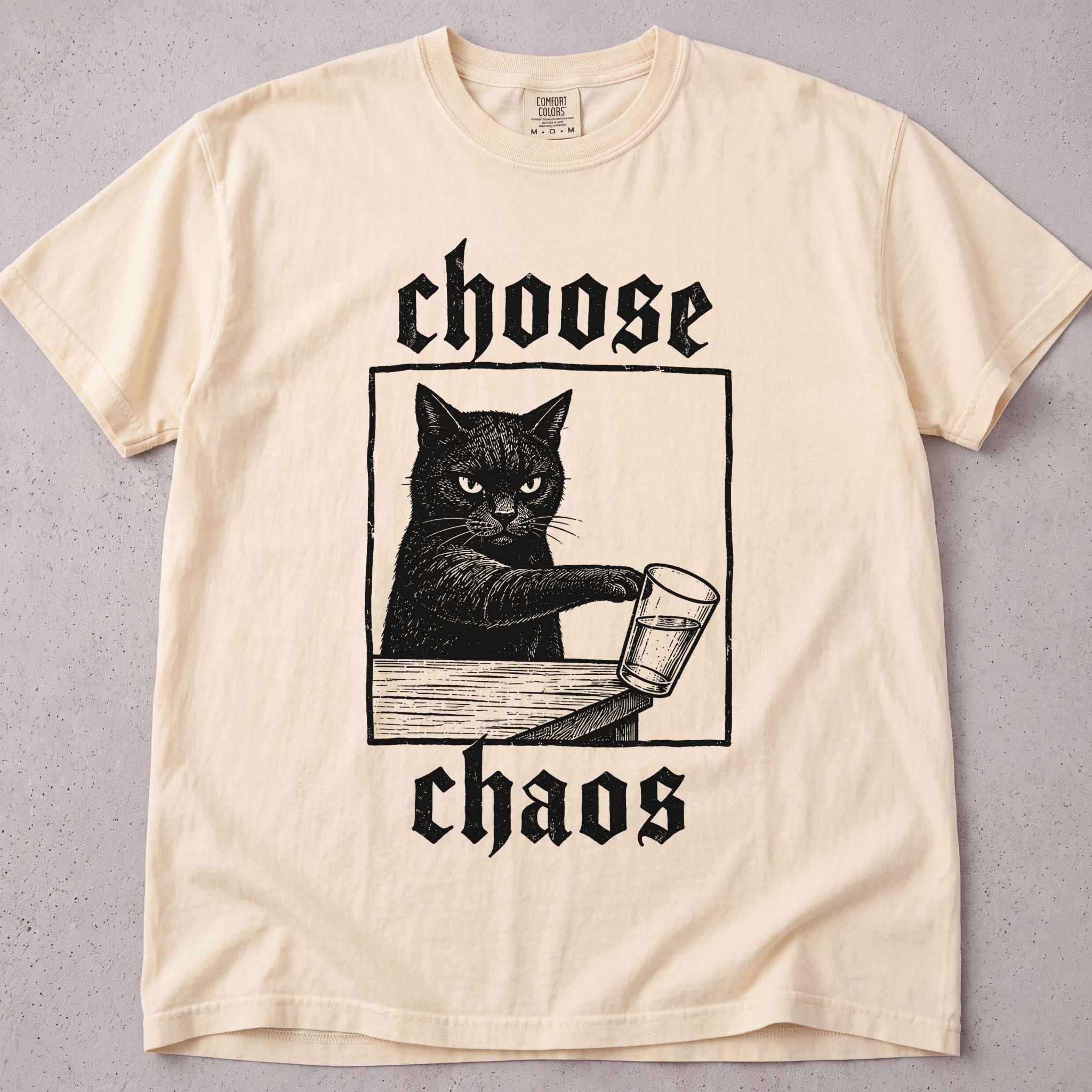 Ivory cat t-shirt with Choose Chaos printed graphic, funny cat lover tee on soft Comfort Colors cotton, flat lay front view