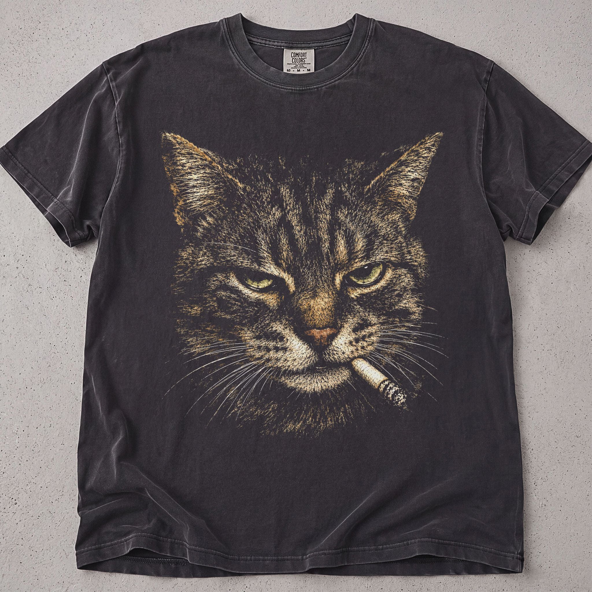 Pepper brown cat t-shirt with a tough tabby cat portrait holding a cigarette graphic, cat lover tee on soft Comfort Colors cotton, flat lay front view