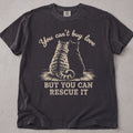 Pepper brown cat t-shirt with a cat illustration and You Can't Buy Love But You Can Rescue It text, cat lover tee on soft Comfort Colors cotton, flat lay front view