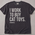 Pepper brown cat t-shirt with I Work To Buy Cat Toys printed text graphic, funny cat lover tee on soft Comfort Colors cotton, flat lay front view