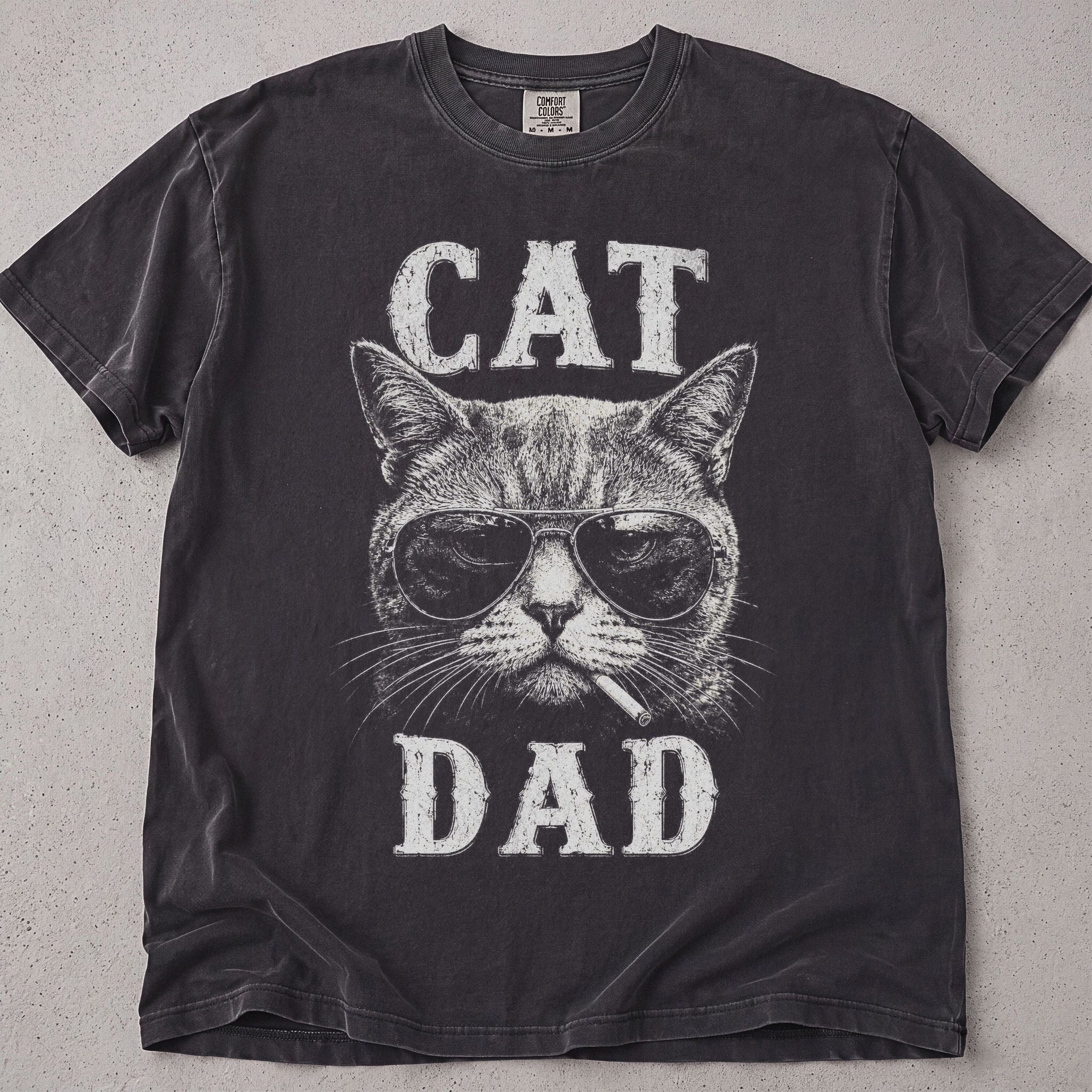 Pepper brown cat dad t-shirt with a cool cat wearing sunglasses and Cat Dad text, cat lover tee on soft Comfort Colors cotton, flat lay front view