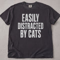 Pepper brown cat t-shirt with Easily Distracted By Cats printed text graphic, funny cat lover tee on soft Comfort Colors cotton, flat lay front view