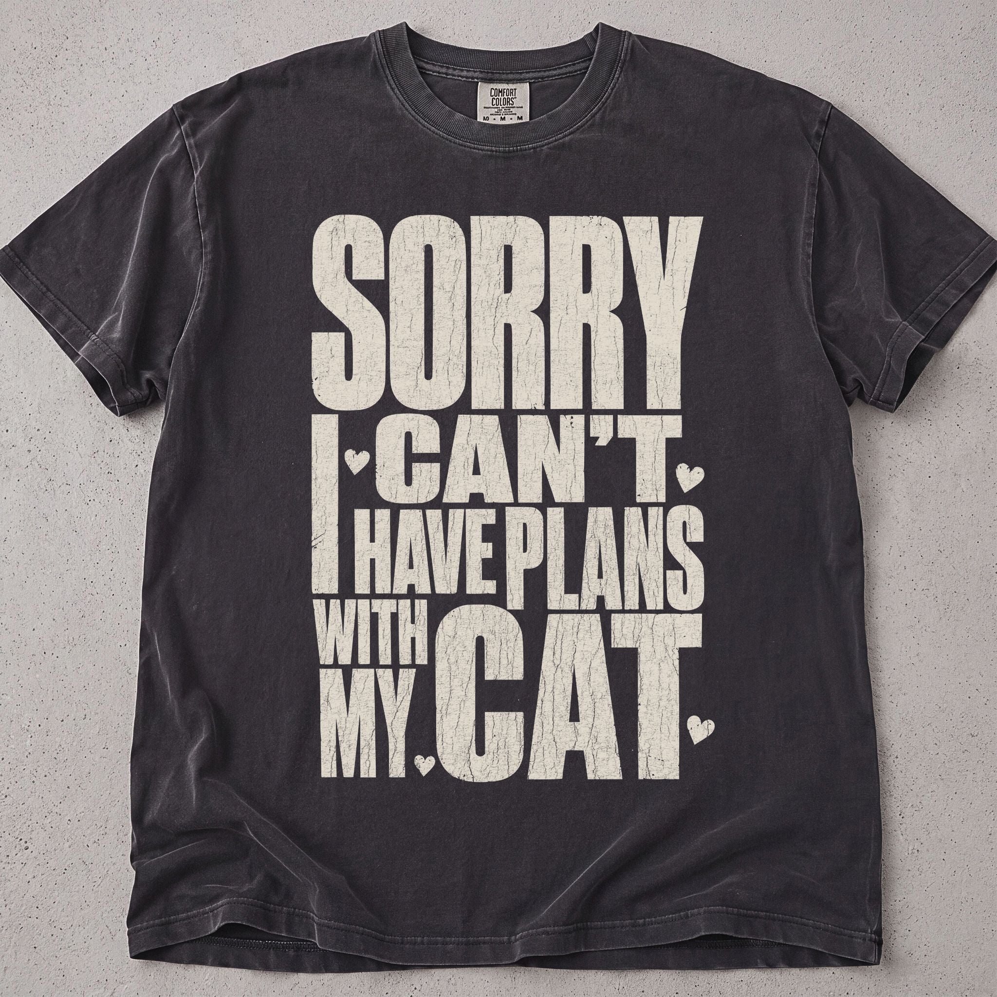 Pepper brown cat t-shirt with Sorry I Can't I Have Plans With My Cat printed text graphic, funny cat lover tee on soft Comfort Colors cotton, flat lay front view
