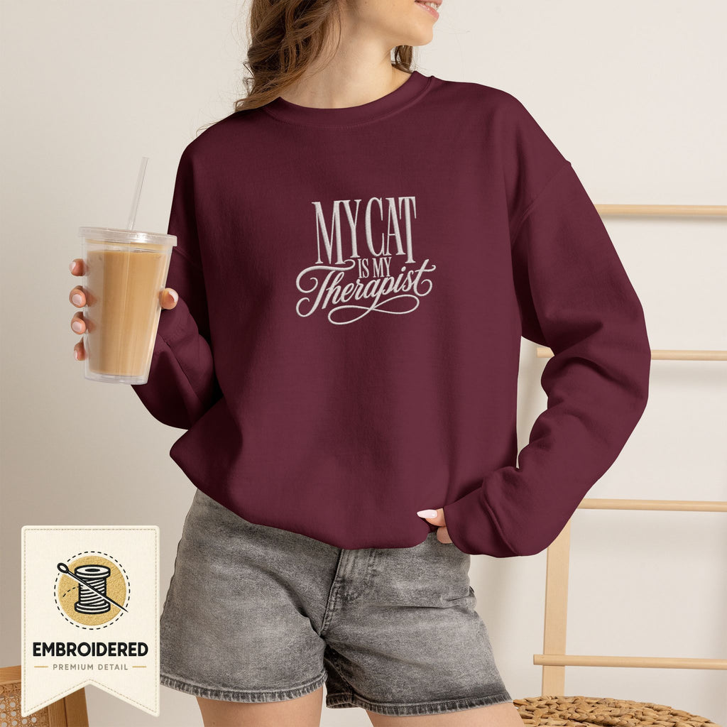Maroon embroidered My Cat Is My Therapist cat lover crewneck sweatshirt worn by a model