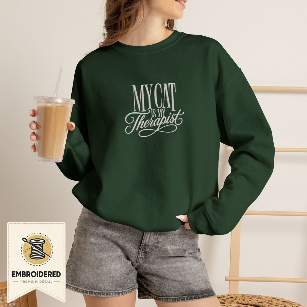 Forest green embroidered My Cat Is My Therapist cat lover crewneck sweatshirt worn by a model