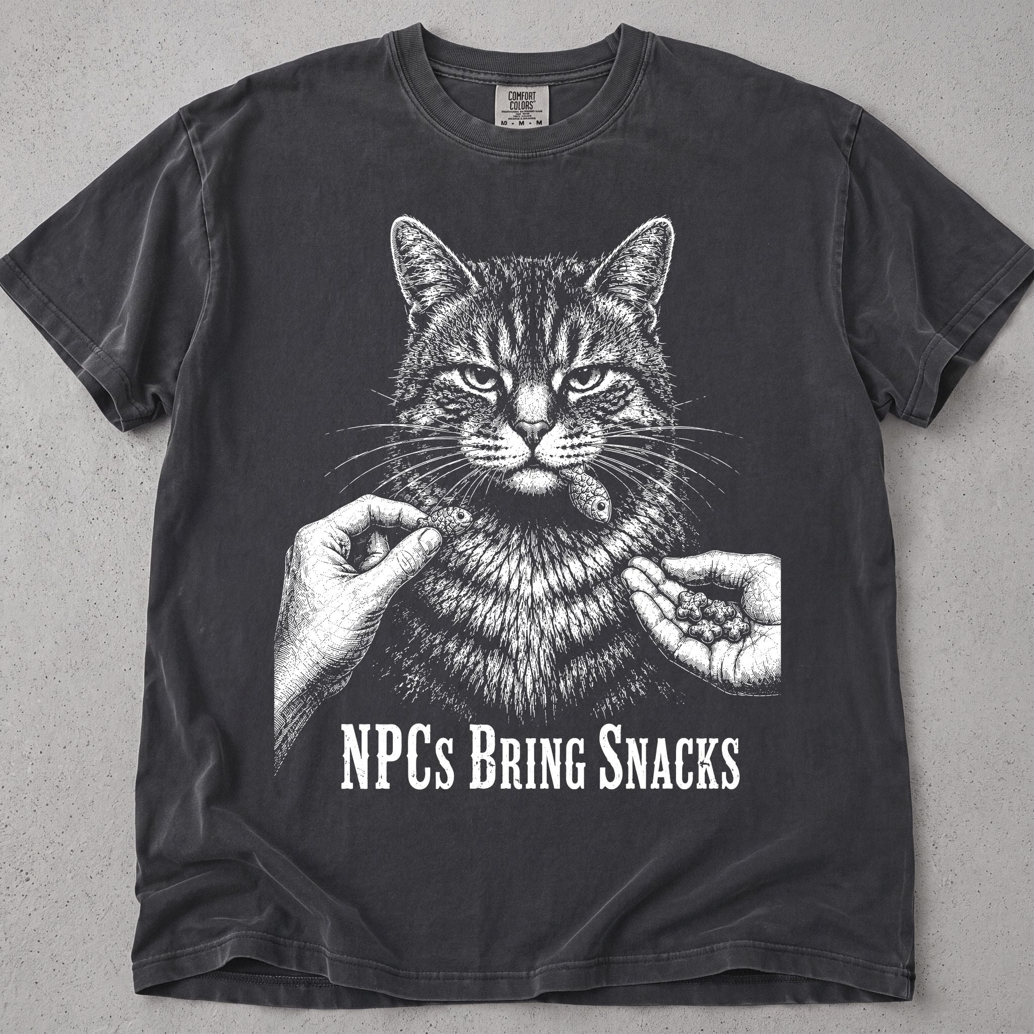 Pepper NPCs Bring Snacks t-shirt with a tabby cat and hands offering treats, front flat lay