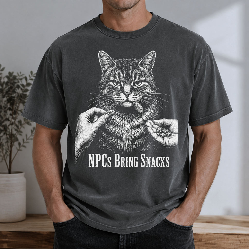 Man wearing a Pepper NPCs Bring Snacks t-shirt with a tabby cat and treat graphic