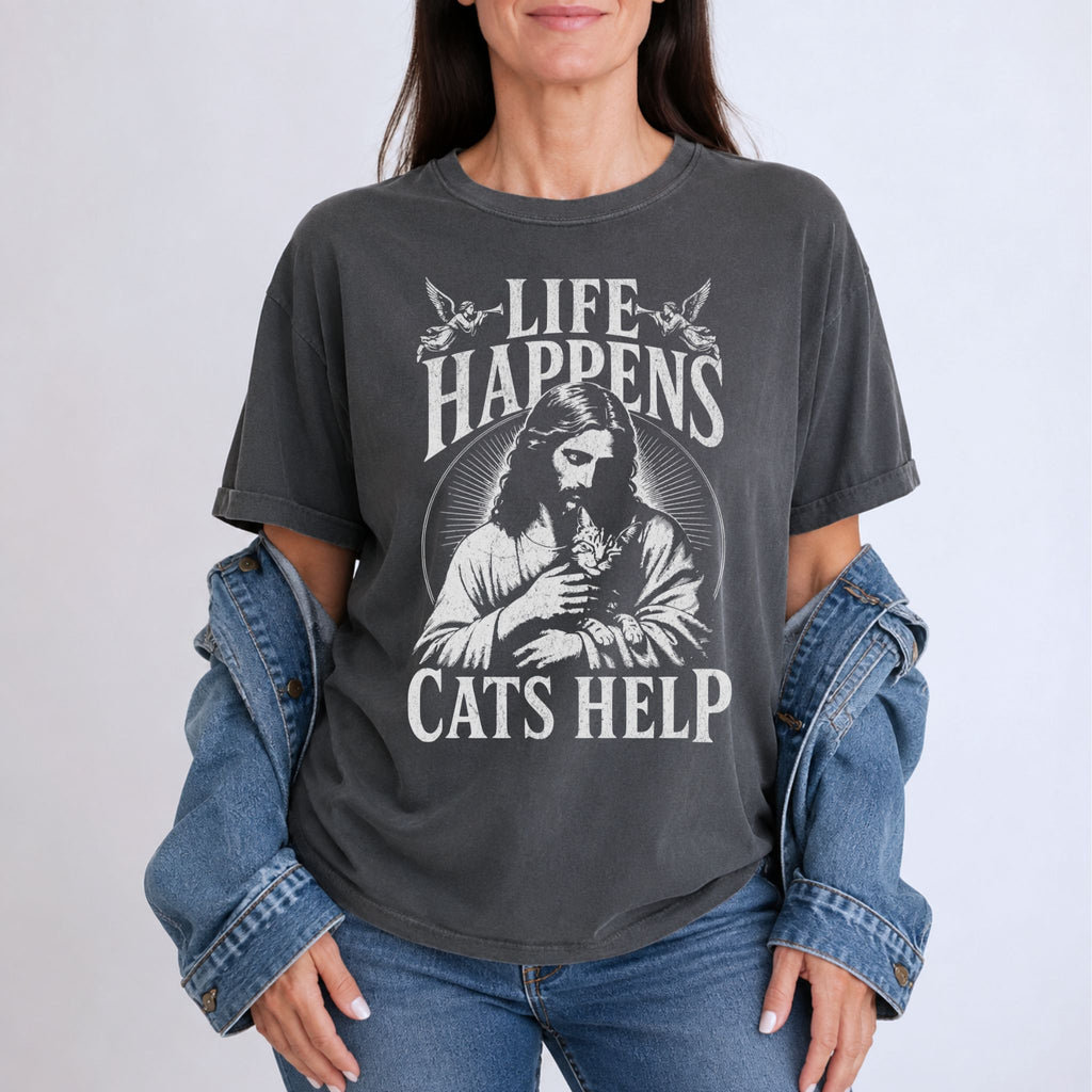 Woman wearing a Pepper Jesus and cat graphic t-shirt with Life Happens, Cats Help text