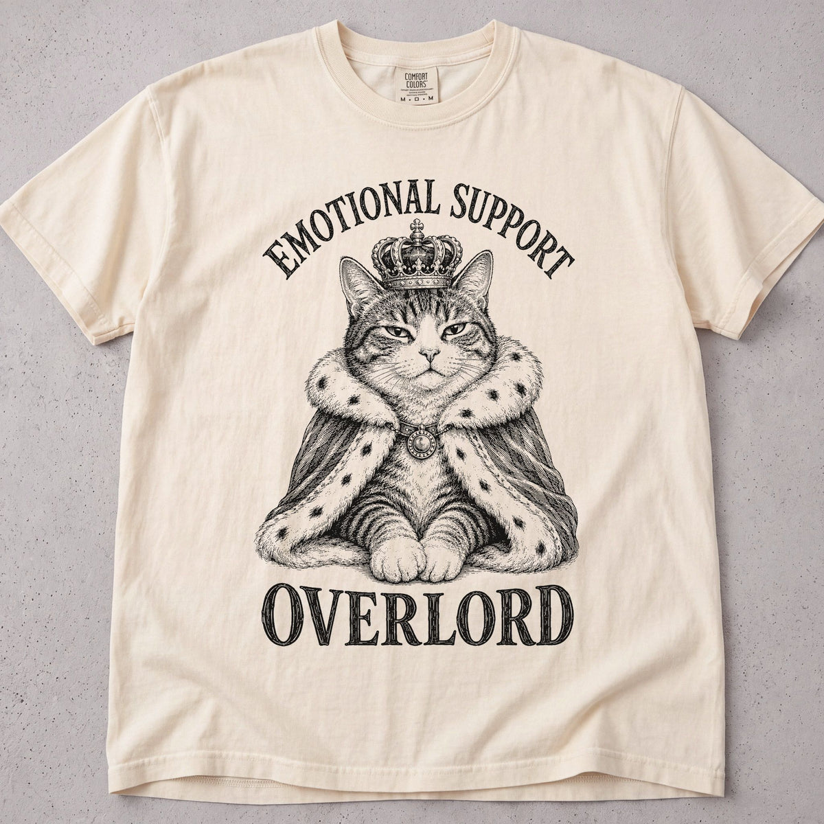 Flat lay of a ivory printed cat lover t-shirt with Emotional Support Overlord graphic