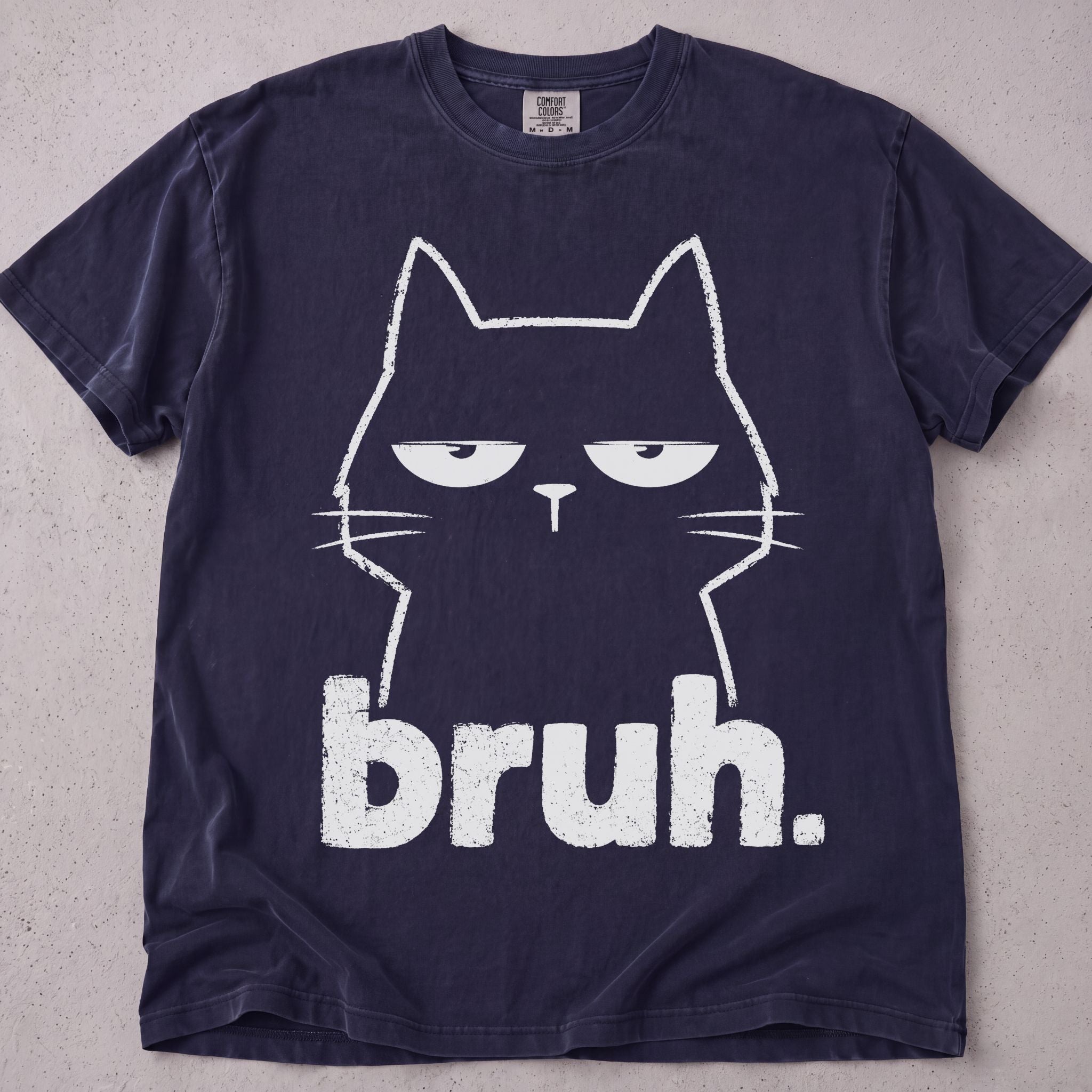 Flat lay of a pepper printed cat lover t-shirt with Bruh Cat graphic
