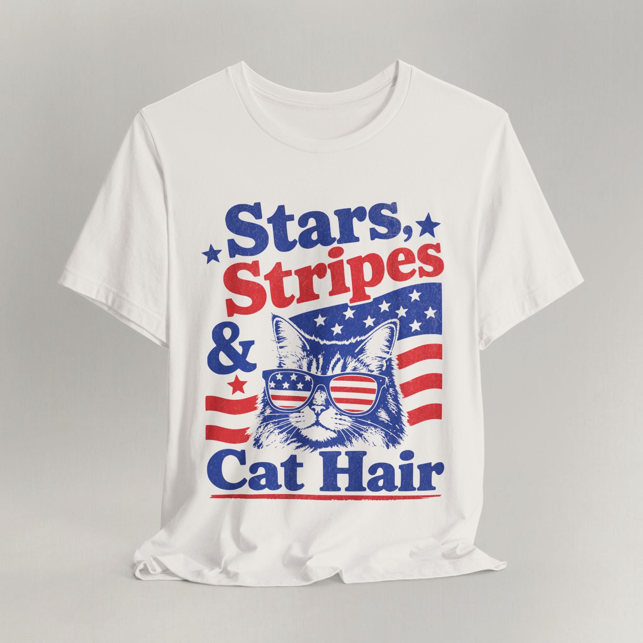 Flat lay of vintage white graphic cat t-shirt with Stars Stripes and Cat Hair design