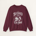 Maroon cat sweatshirt with a printed Blessed Cat Mom design and cat and wildflowers, shown flat