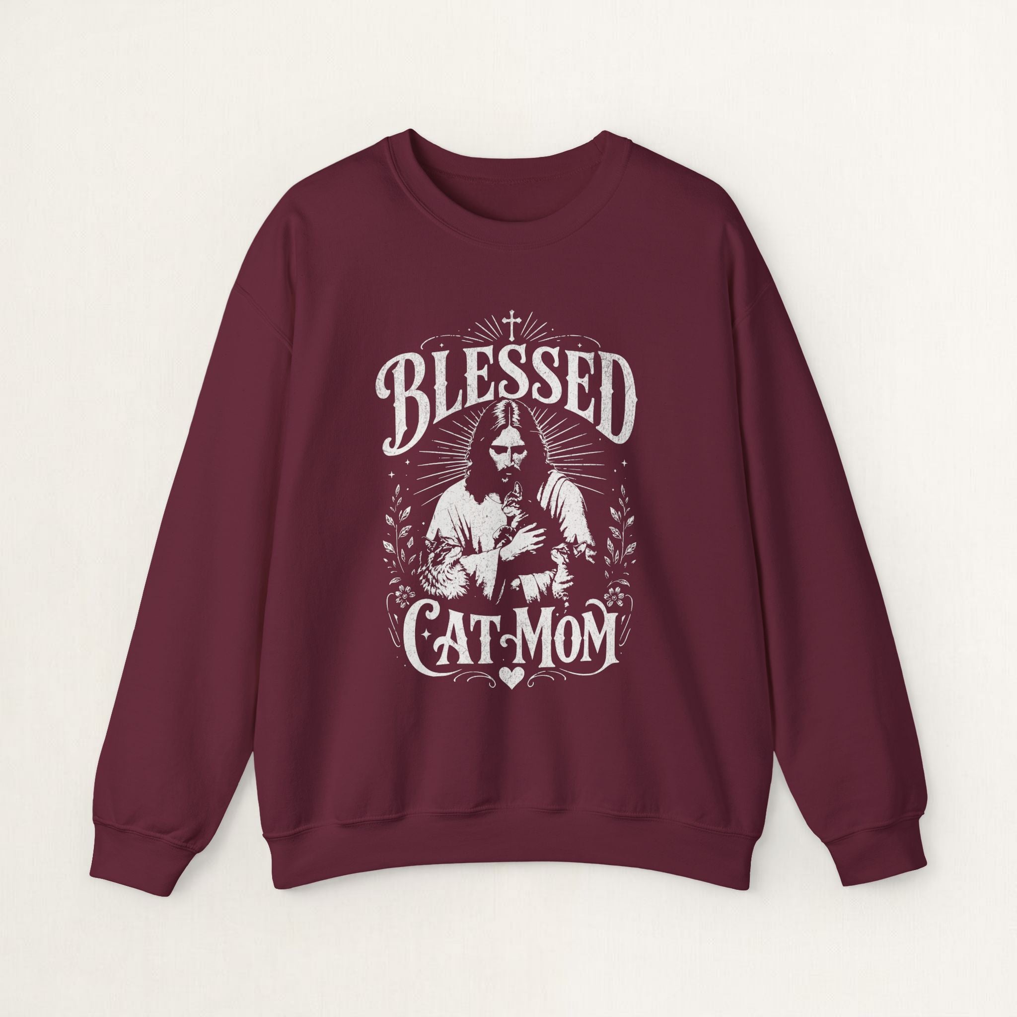 Maroon cat sweatshirt with a printed Blessed Cat Mom design and cat and wildflowers, shown flat