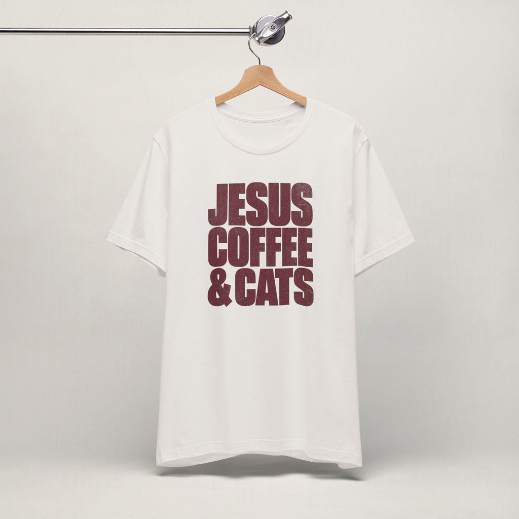 Vintage white Jesus, Coffee & Cats cat t-shirt on a hanger