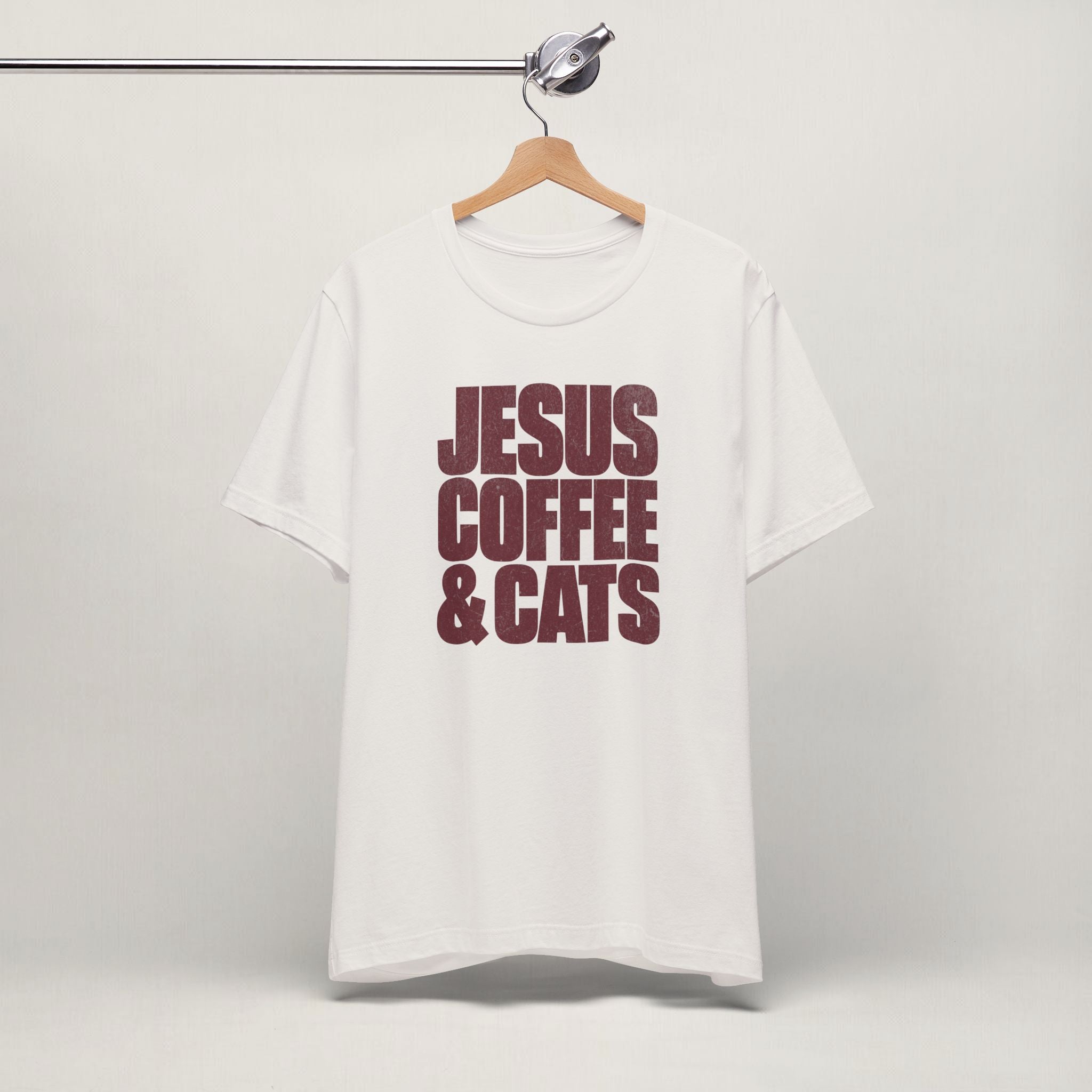 Vintage white Jesus, Coffee & Cats cat t-shirt on a hanger