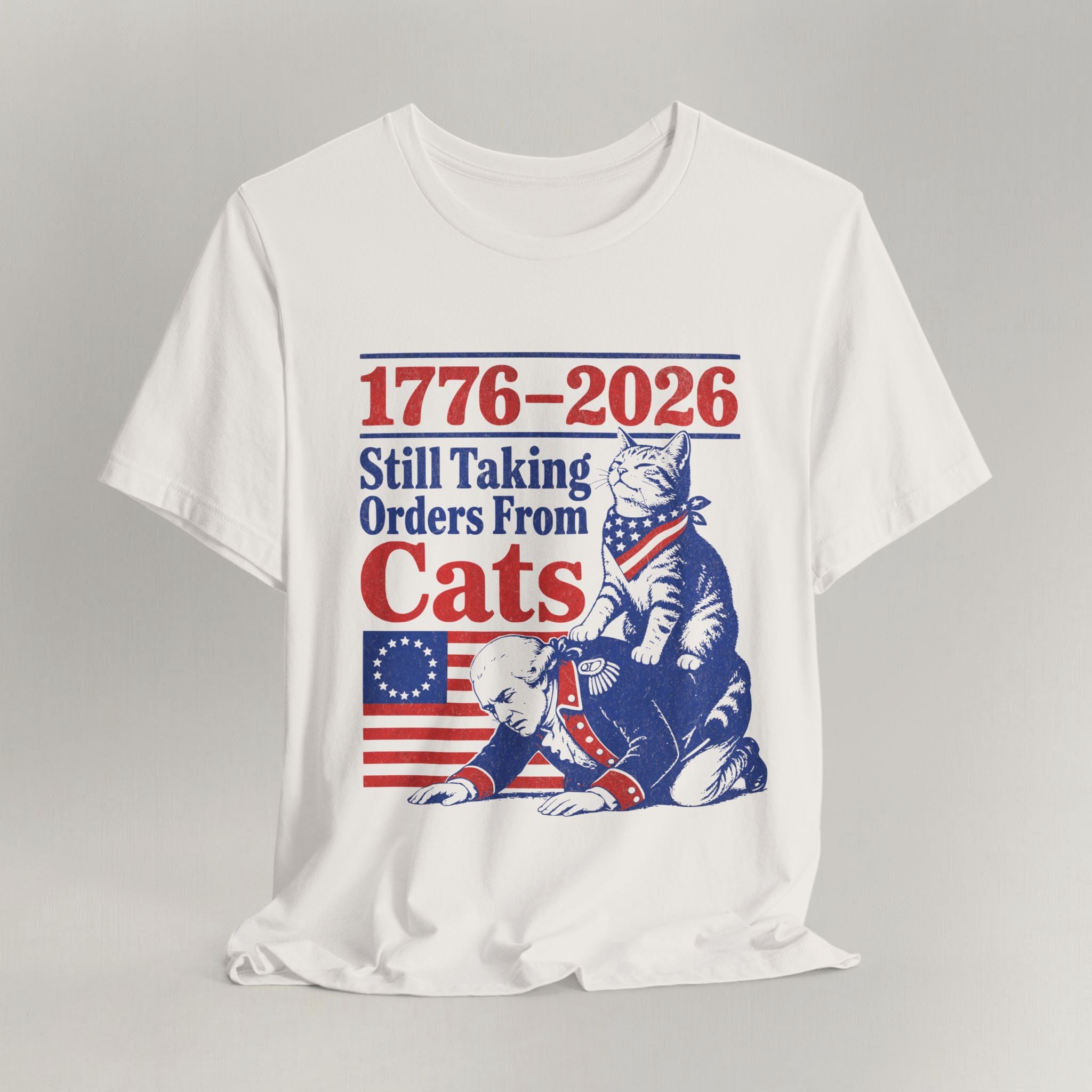 Flat lay of vintage white graphic cat t-shirt with Still Taking Orders From Cats print design