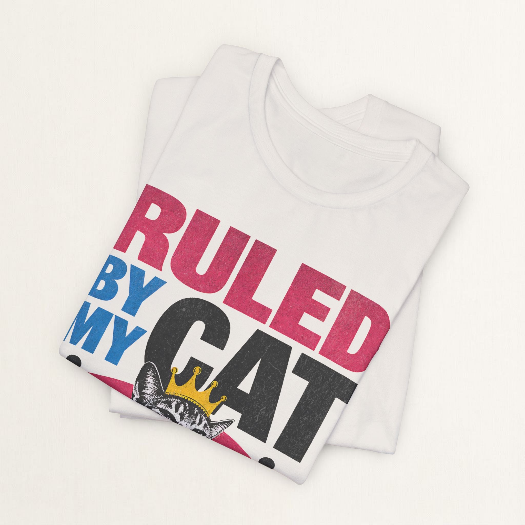Woman wearing vintage white Ruled By My Cat graphic t-shirt, front view
