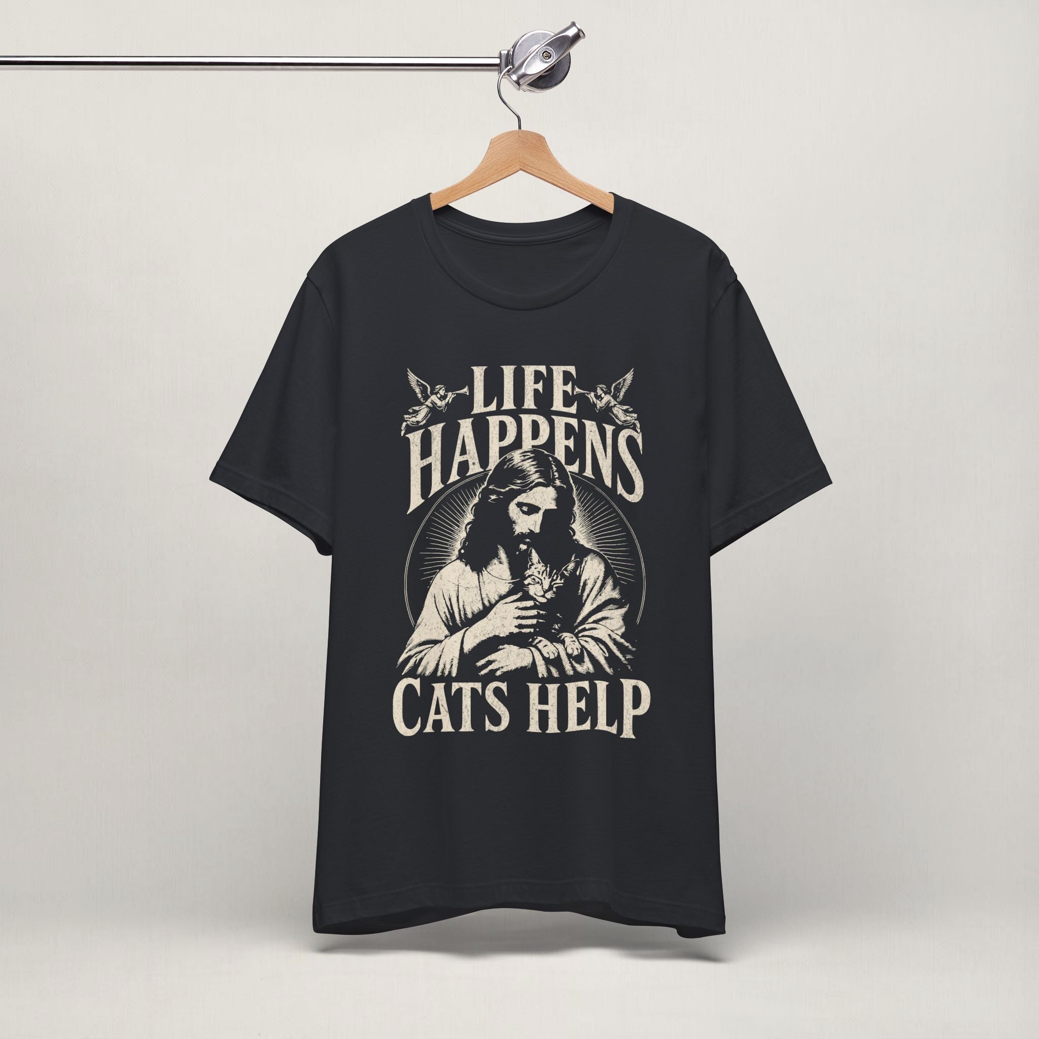 Vintage black Life Happens Cats Help printed cat t-shirt on a hanger