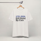 Close-up of Ruled By Cats print on vintage white unisex t-shirt
