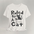 Flat lay of vintage white graphic cat t-shirt with Ruled By A Cat print design