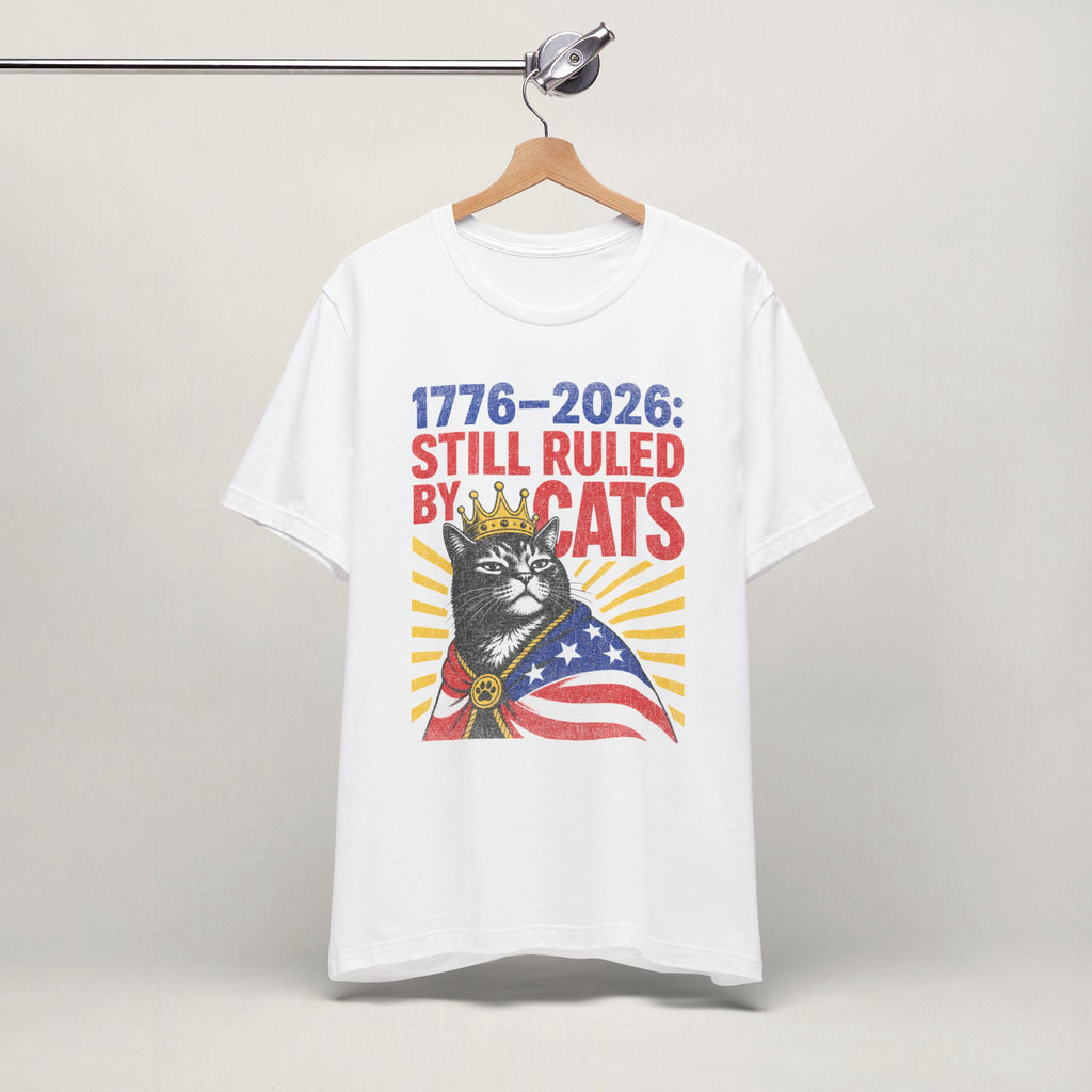 Close-up of Still Ruled By Cats print on white unisex t-shirt