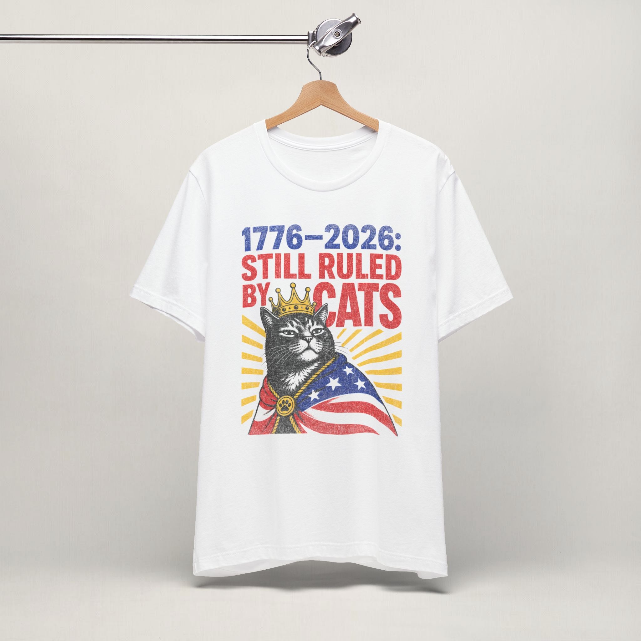 Close-up of Still Ruled By Cats print on white unisex t-shirt