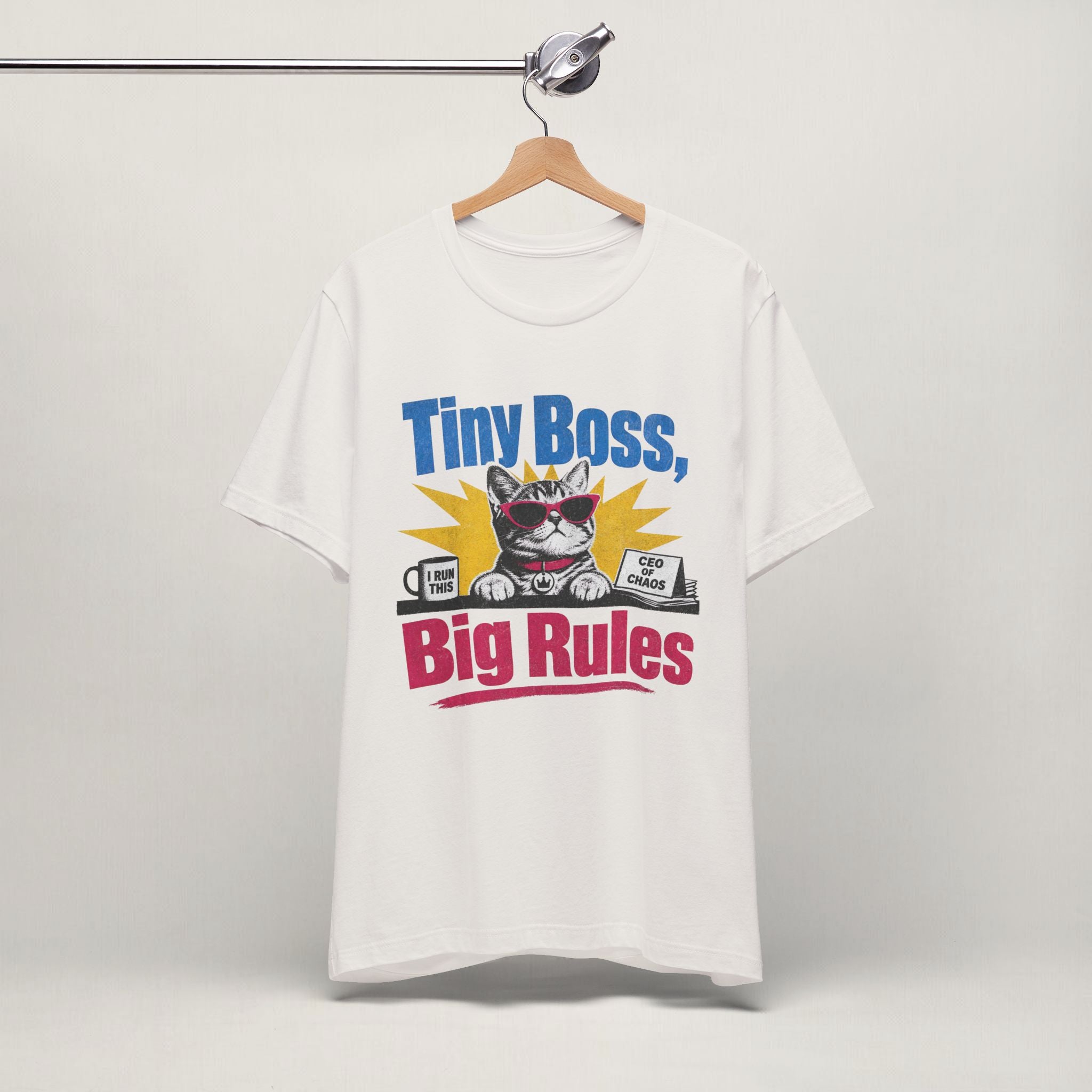 Close-up of Tiny Boss Big Rules print on vintage white unisex t-shirt