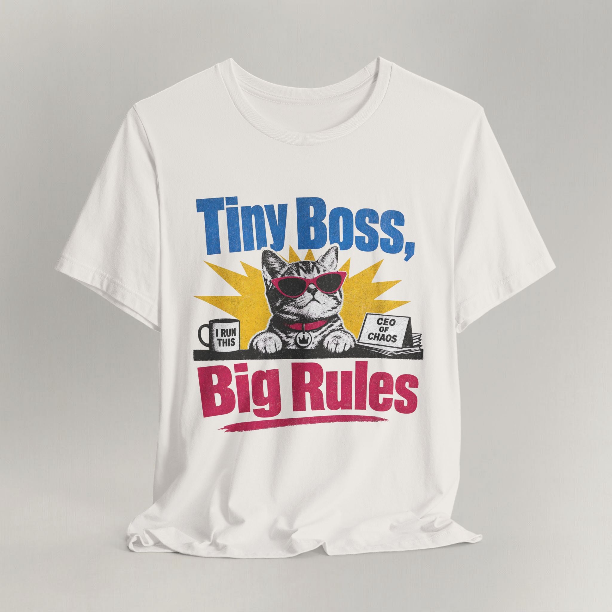 Flat lay of vintage white graphic cat t-shirt with Tiny Boss Big Rules print design