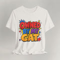 Vintage white t-shirt with bold colorful Owned By My Cat comic-style graphic and starbursts