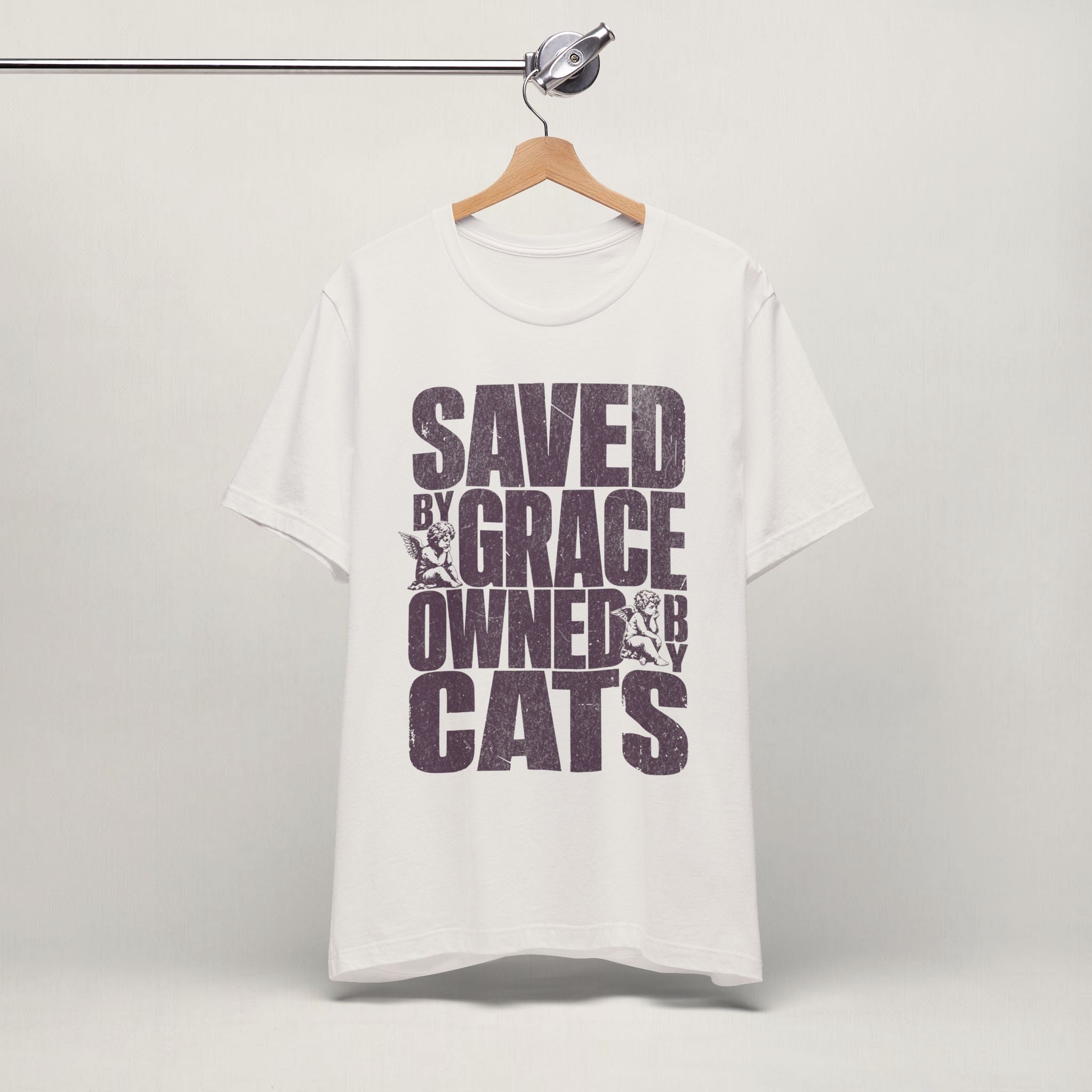 Vintage white Saved by Grace Owned by Cats printed cat t-shirt on a hanger