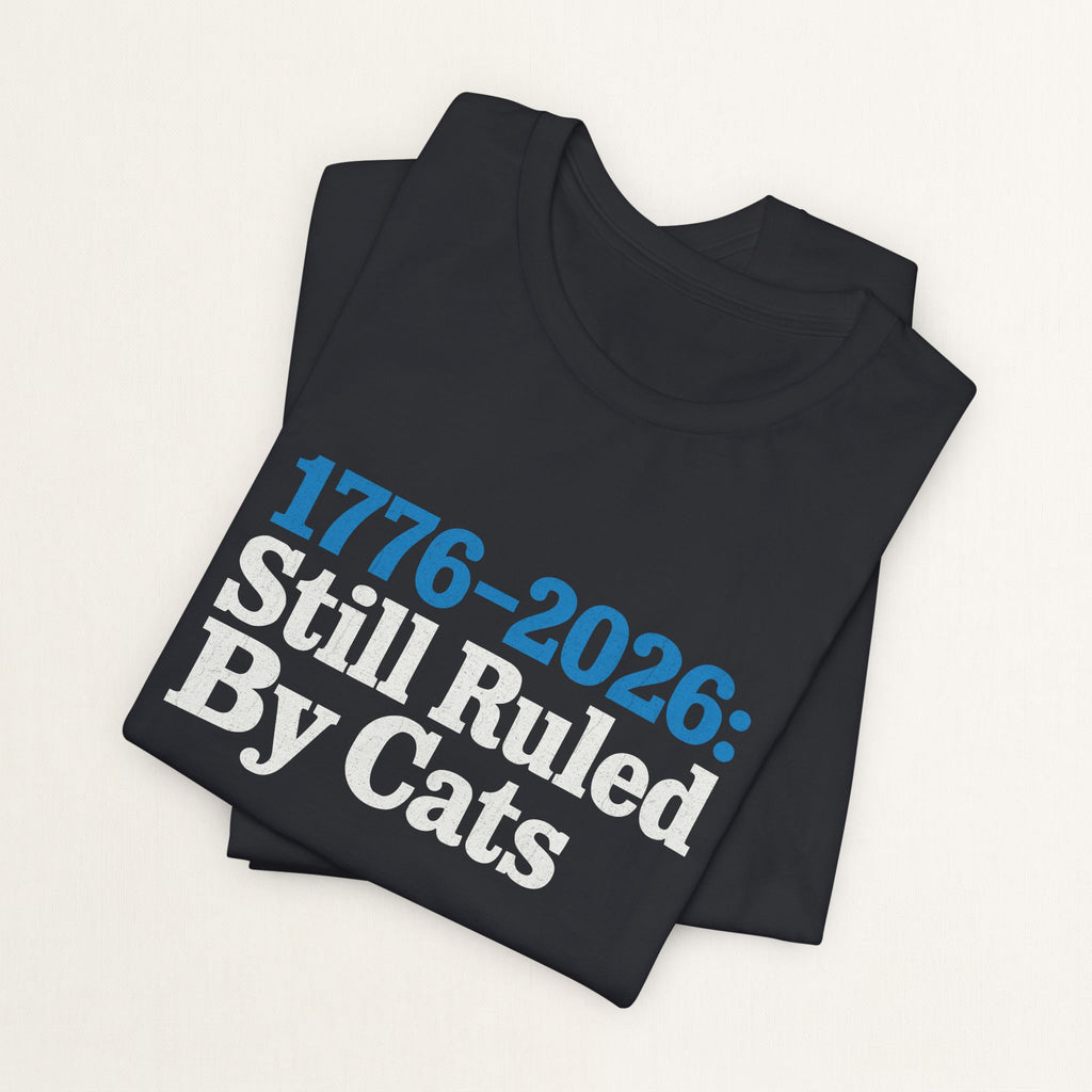Close-up of Ruled By Cats print on vintage black unisex t-shirt