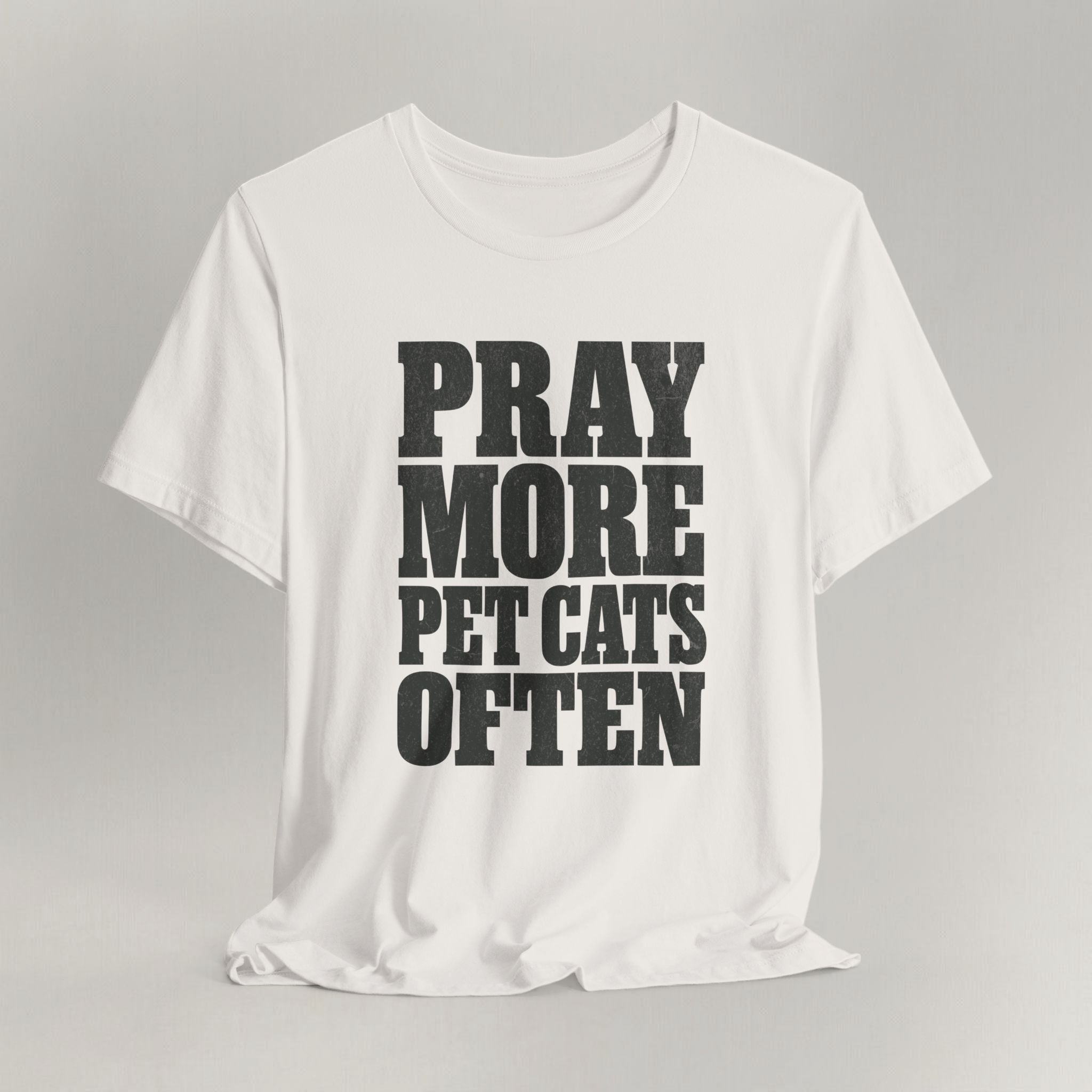 Vintage white cat t-shirt with a bold Pray More, Pet Cats Often design, shown flat