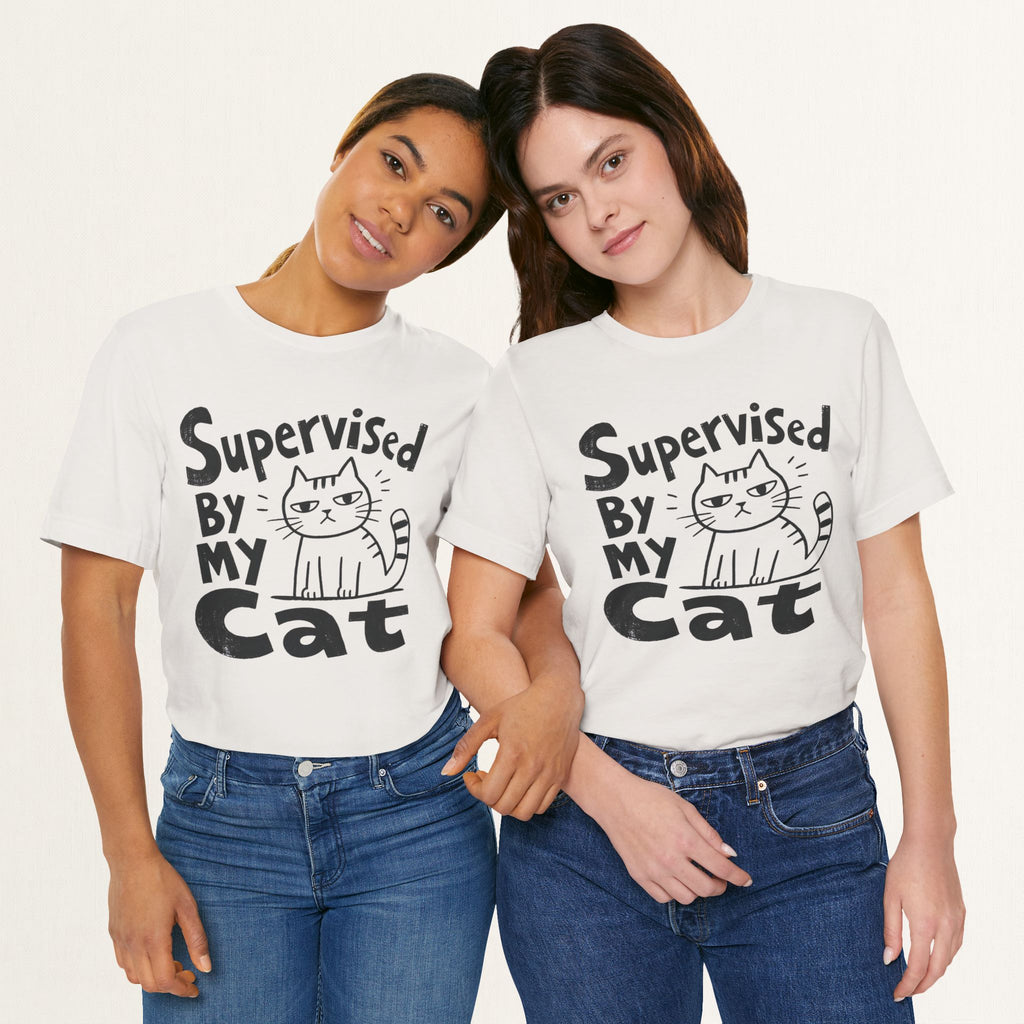 Two women wearing vintage white Supervised By My Cat t-shirts with striped cat sketch