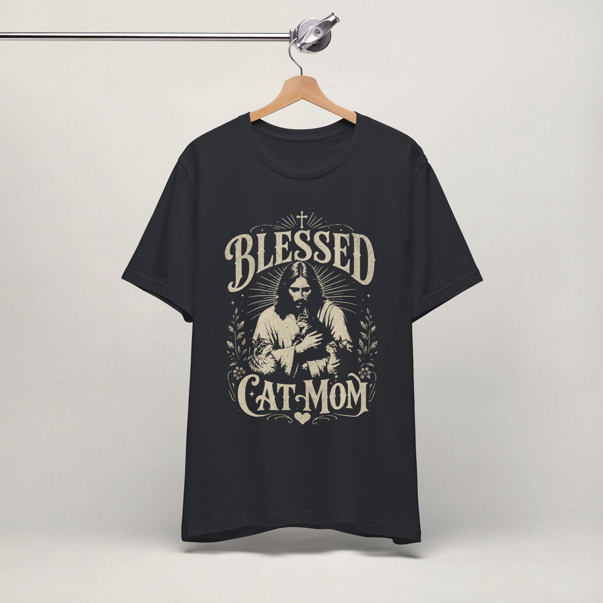 Vintage black Blessed Cat Mom printed cat t-shirt on a hanger