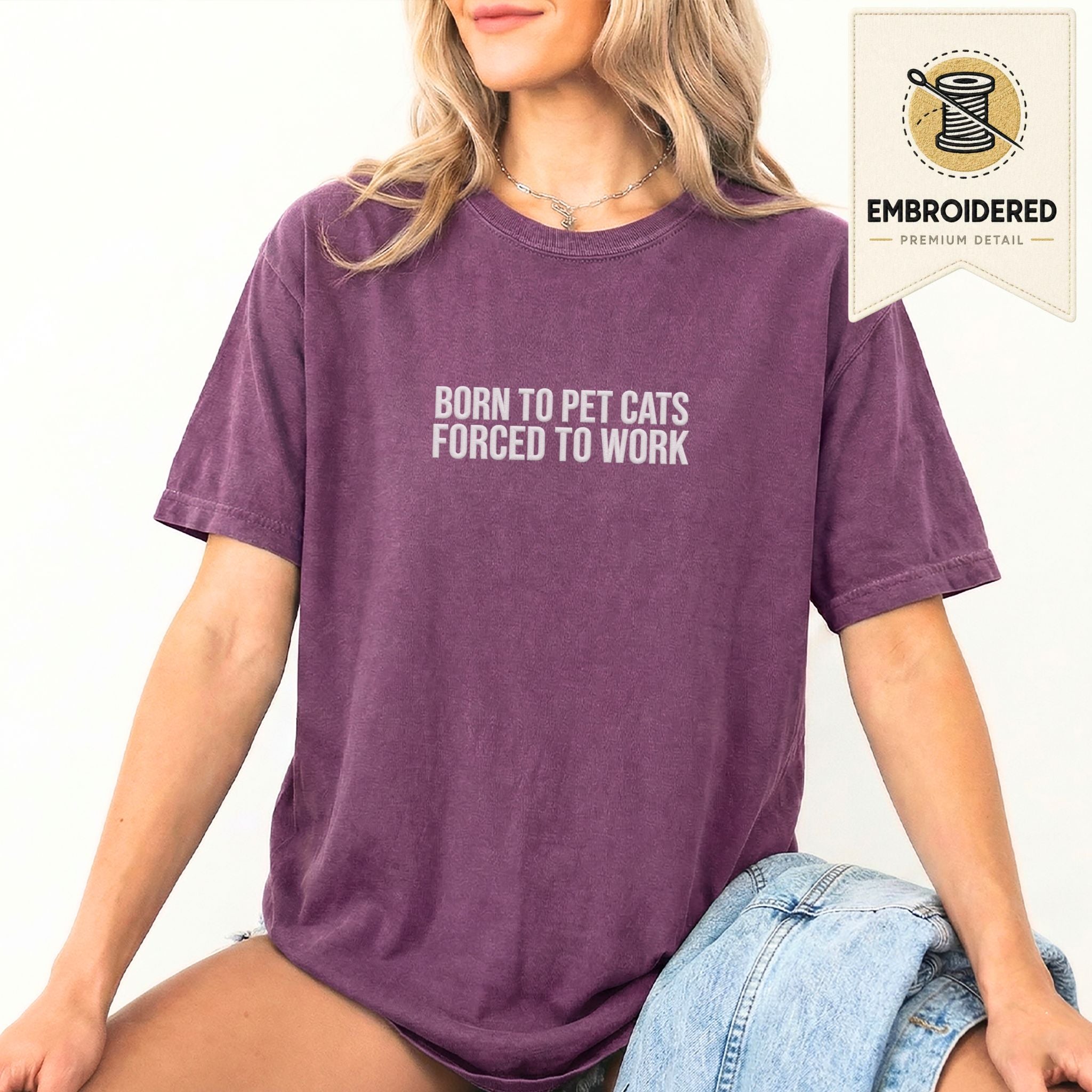 Woman wearing a berry embroidered 'Born To Pet Cats' t-shirt
