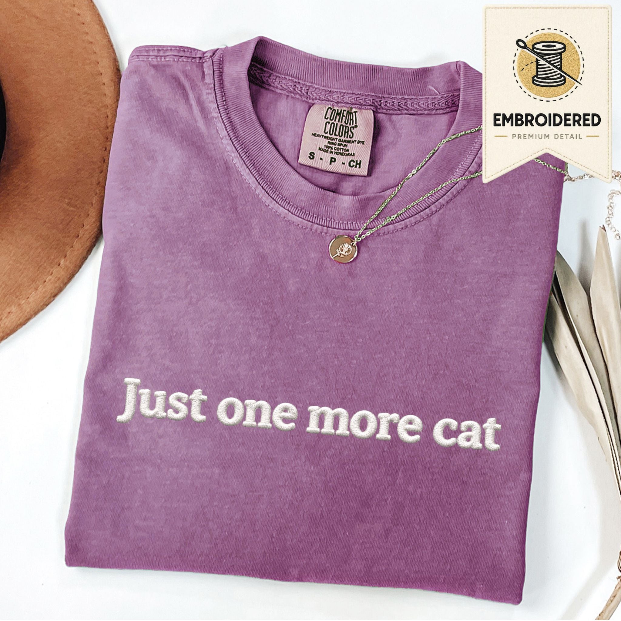 Berry embroidered cat t-shirt with 'Just One More Cat' chest design, shown flat